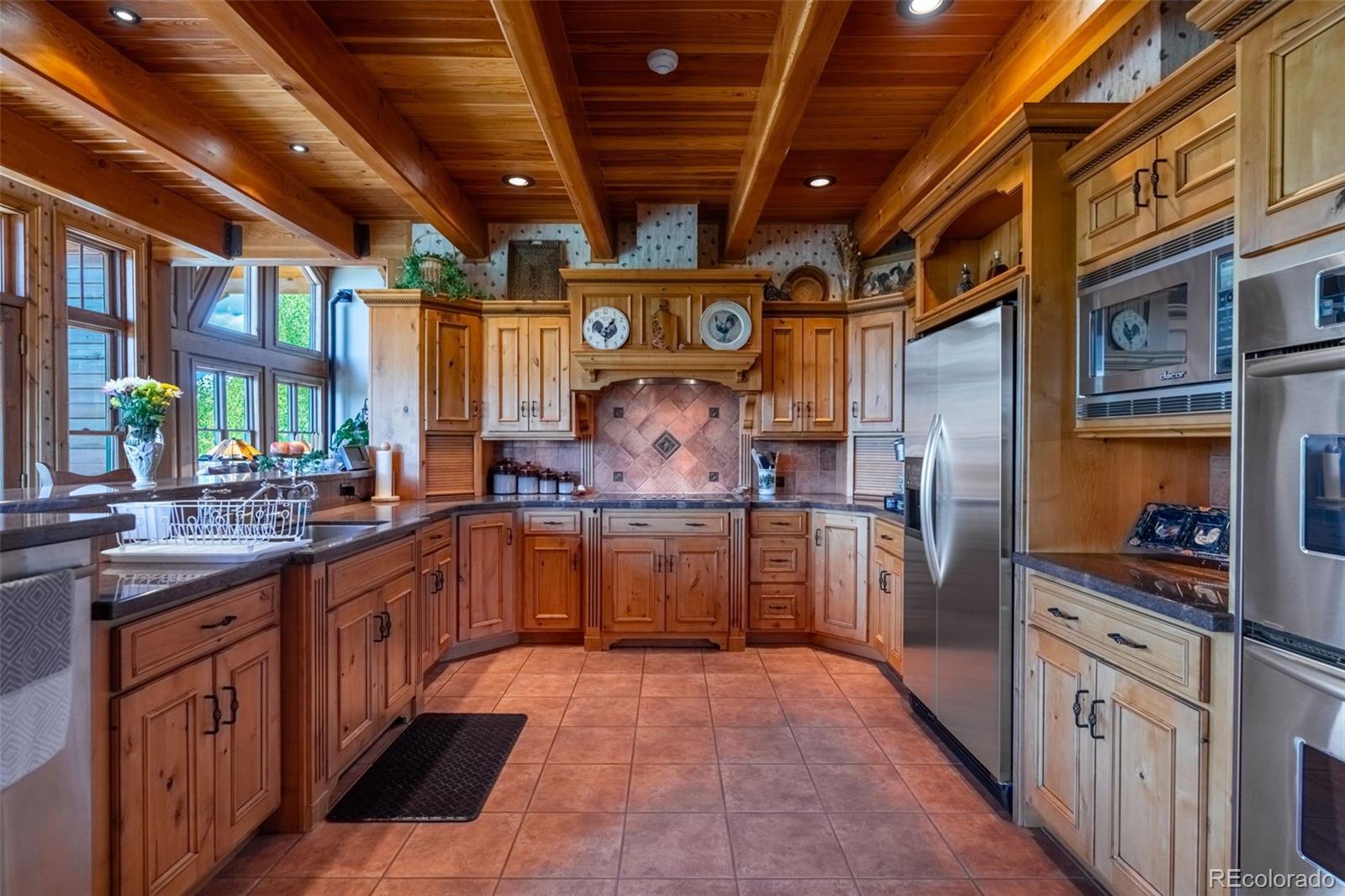 157 Cap Rock Road Canon City, CO 81212 - Photo 10 of 50 a kitchen with stainless steel appliances granite countertop lots of counter top space