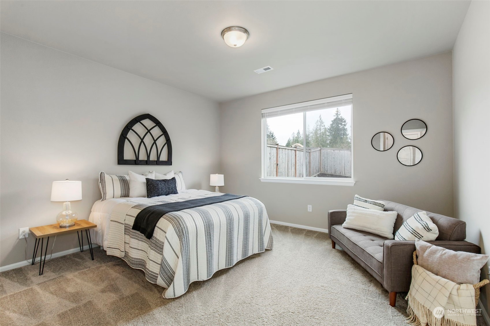 1496 Baker Heights Loop Bremerton, WA 98312 - Photo 13 of 27 a bedroom with a bed and a window