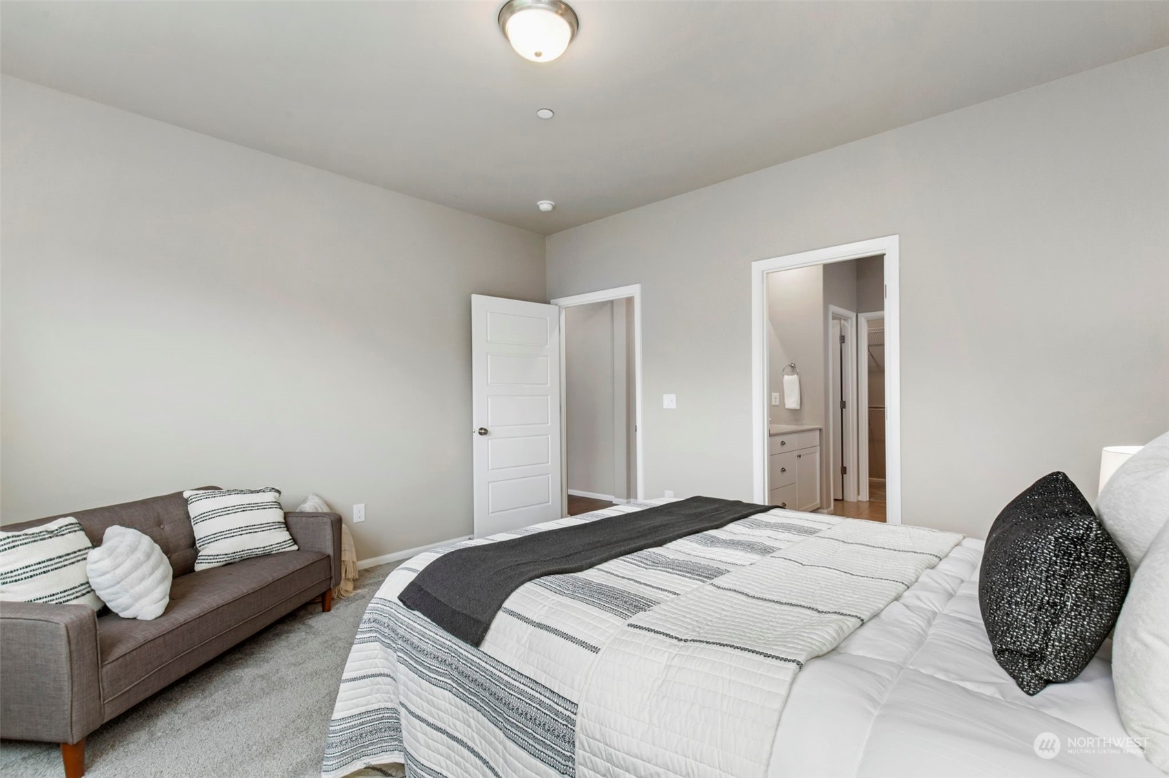 1496 Baker Heights Loop Bremerton, WA 98312 - Photo 14 of 27 a bedroom with a bed and a couch