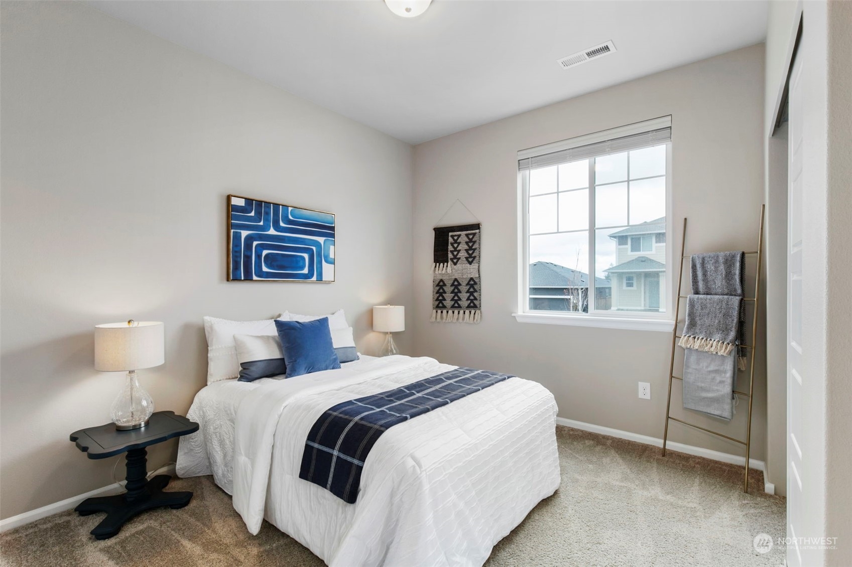 1496 Baker Heights Loop Bremerton, WA 98312 - Photo 19 of 27 a bedroom with a bed and a window