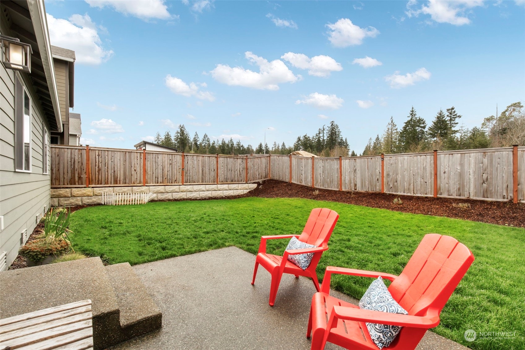 1496 Baker Heights Loop Bremerton, WA 98312 - Photo 24 of 27 a view of yard with furniture and a garden