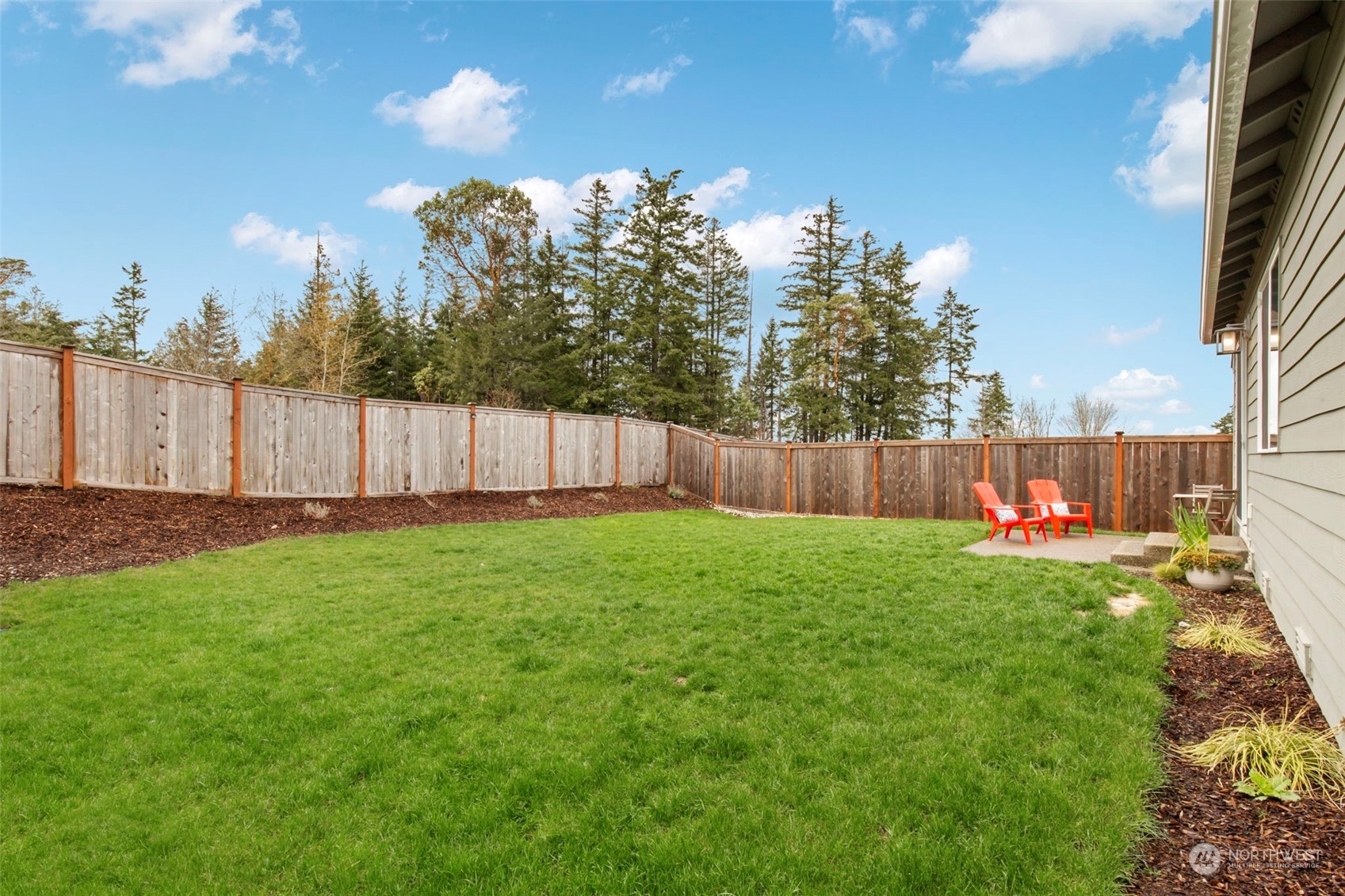 1496 Baker Heights Loop Bremerton, WA 98312 - Photo 25 of 27 a view of a backyard with of the house and outdoor seating