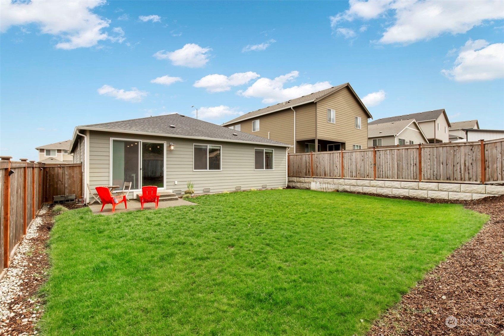 1496 Baker Heights Loop Bremerton, WA 98312 - Photo 26 of 27 a view of a house with backyard and garden