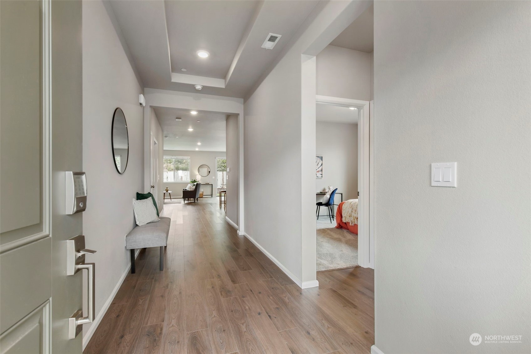 1496 Baker Heights Loop Bremerton, WA 98312 - Photo 4 of 27 a view of a hallway view with wooden floor and staircase