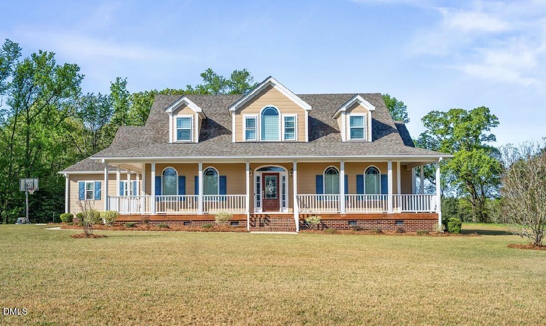 5780 McArthur Road Broadway, NC 27505 - Photo 2 of 40 front view of a house with a yard