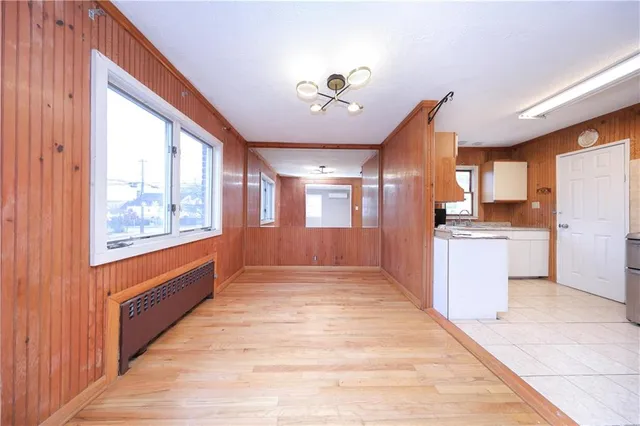 a view of a kitchen with a sink and a window