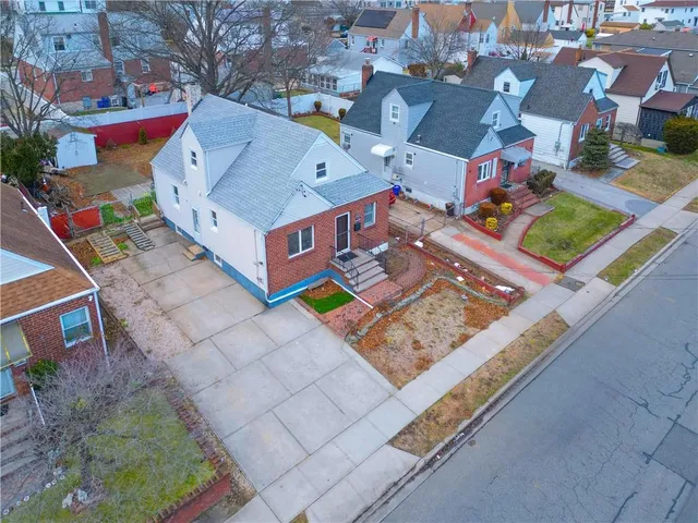 an aerial view of residential house with outdoor space and swimming pool