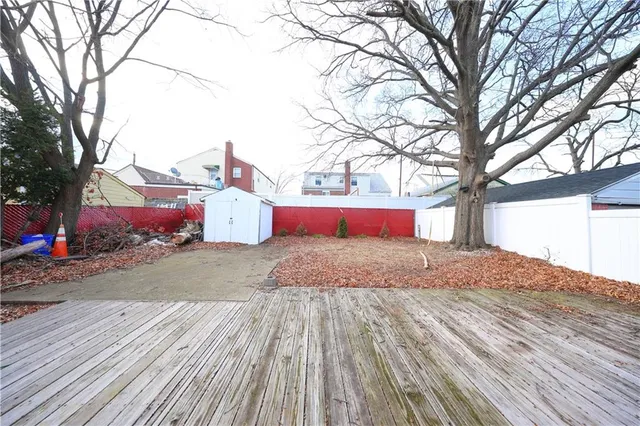 a view of a backyard with a white house