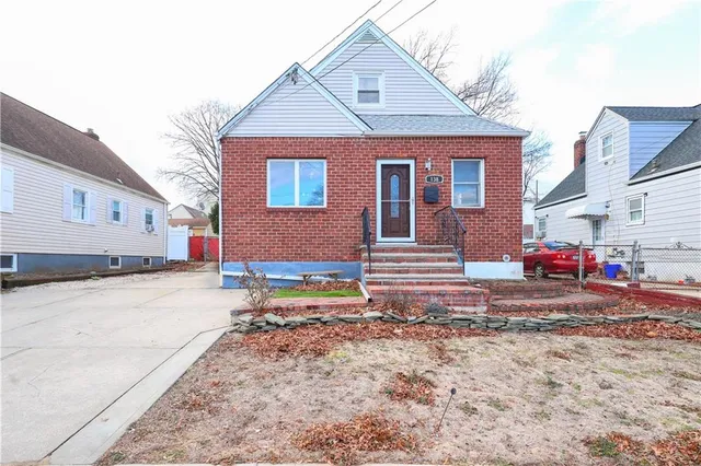 a view of a house with snow on the road