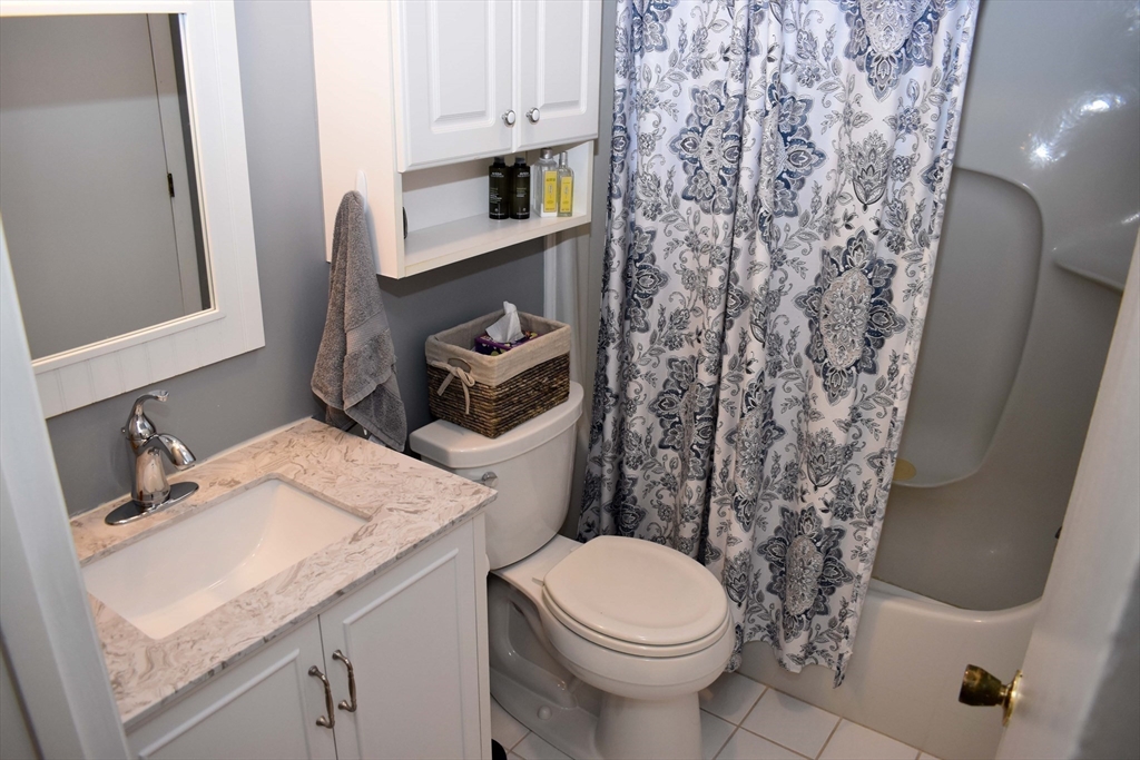 6 Round House Road, Unit 6 Bourne, MA 02532 - Photo 13 of 29 a bathroom with a sink toilet and shower