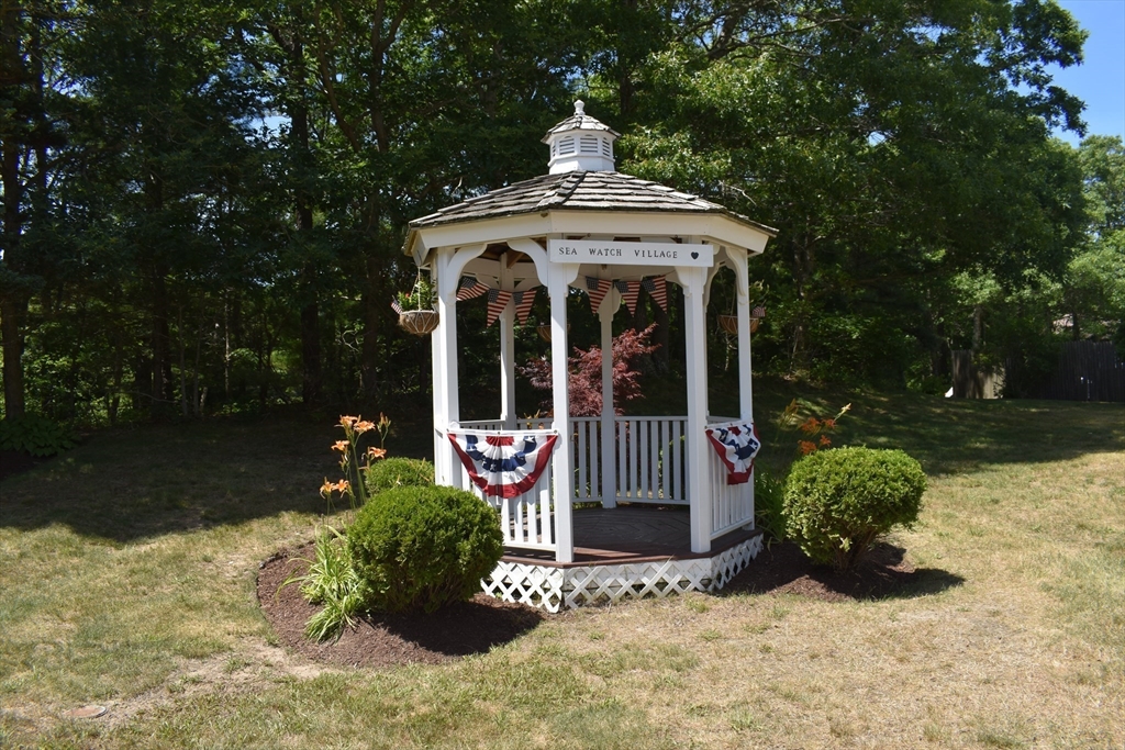 6 Round House Road, Unit 6 Bourne, MA 02532 - Photo 21 of 29 a front view of a house with garden