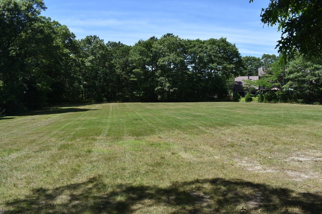 6 Round House Road, Unit 6 Bourne, MA 02532 - Photo 24 of 29 a view of outdoor space with trees all around