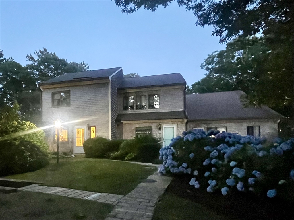6 Round House Road, Unit 6 Bourne, MA 02532 - Photo 25 of 29 a front view of a house with a garden