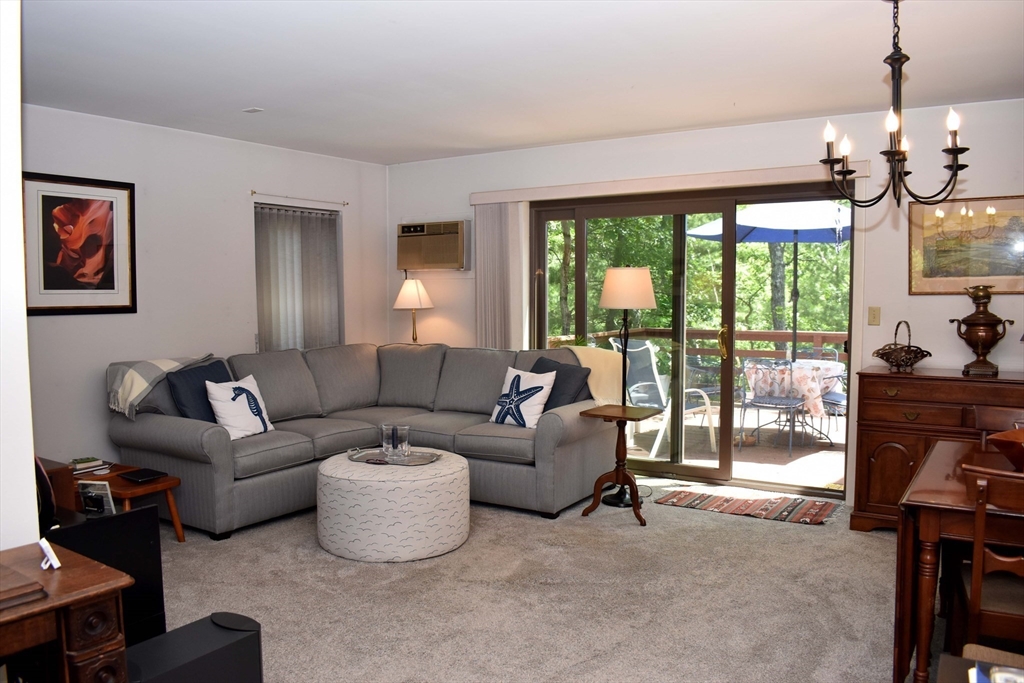 6 Round House Road, Unit 6 Bourne, MA 02532 - Photo 4 of 29 a living room with furniture and a large window