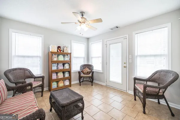 a living room with furniture and a window