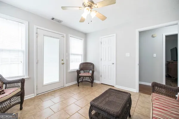 a living room with furniture and a window