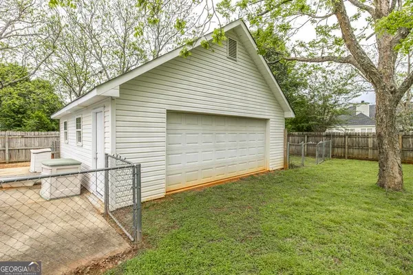 a view of backyard with small cabin