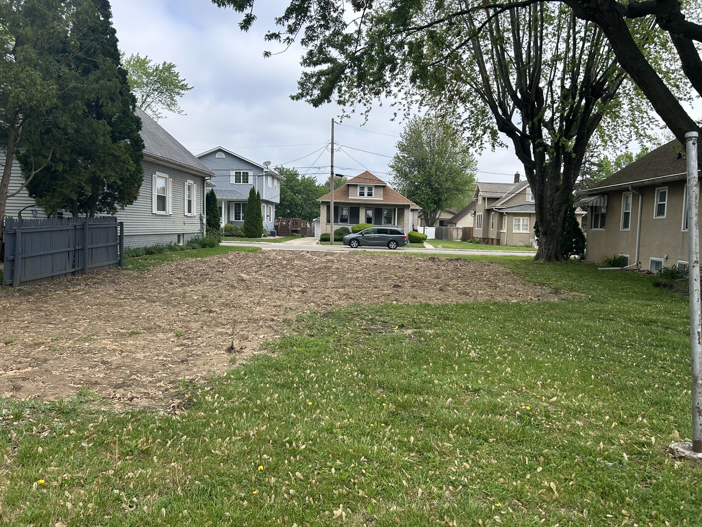 616 12th Street Peru, IL 61354 - Photo 5 of 10 a front view of a house with a garden and trees