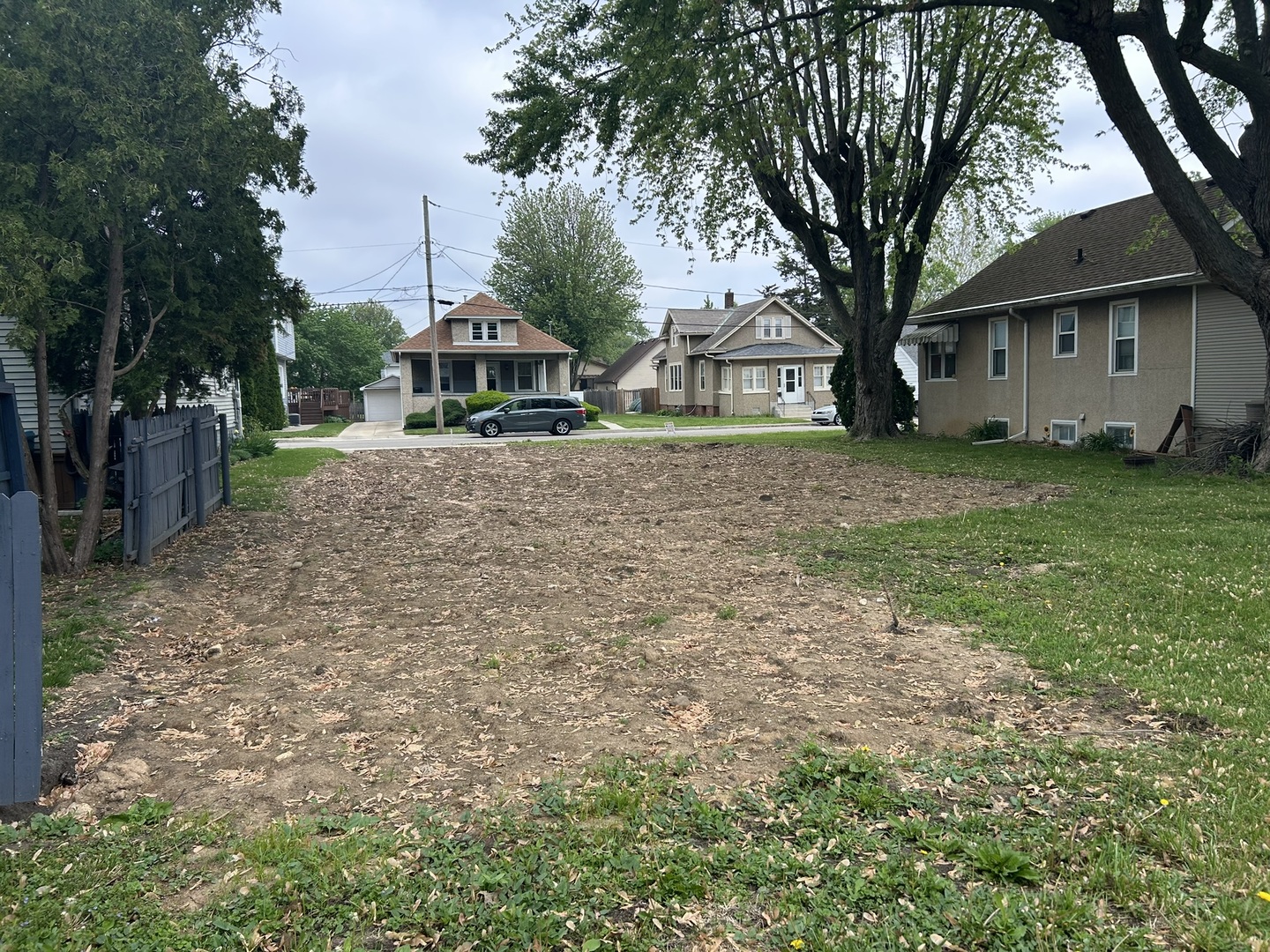 616 12th Street Peru, IL 61354 - Photo 6 of 10 a front view of a house with a garden and trees