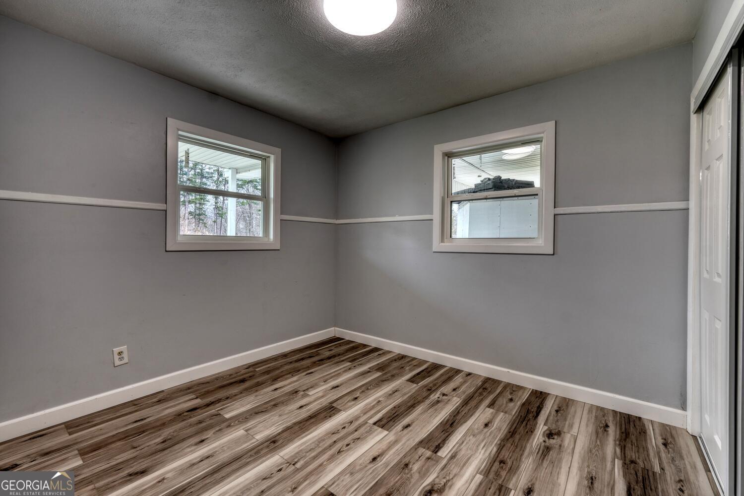 16 Antioch Church Road Blairsville, GA 30512 - Photo 23 of 36 a view of a room with wooden floor and window