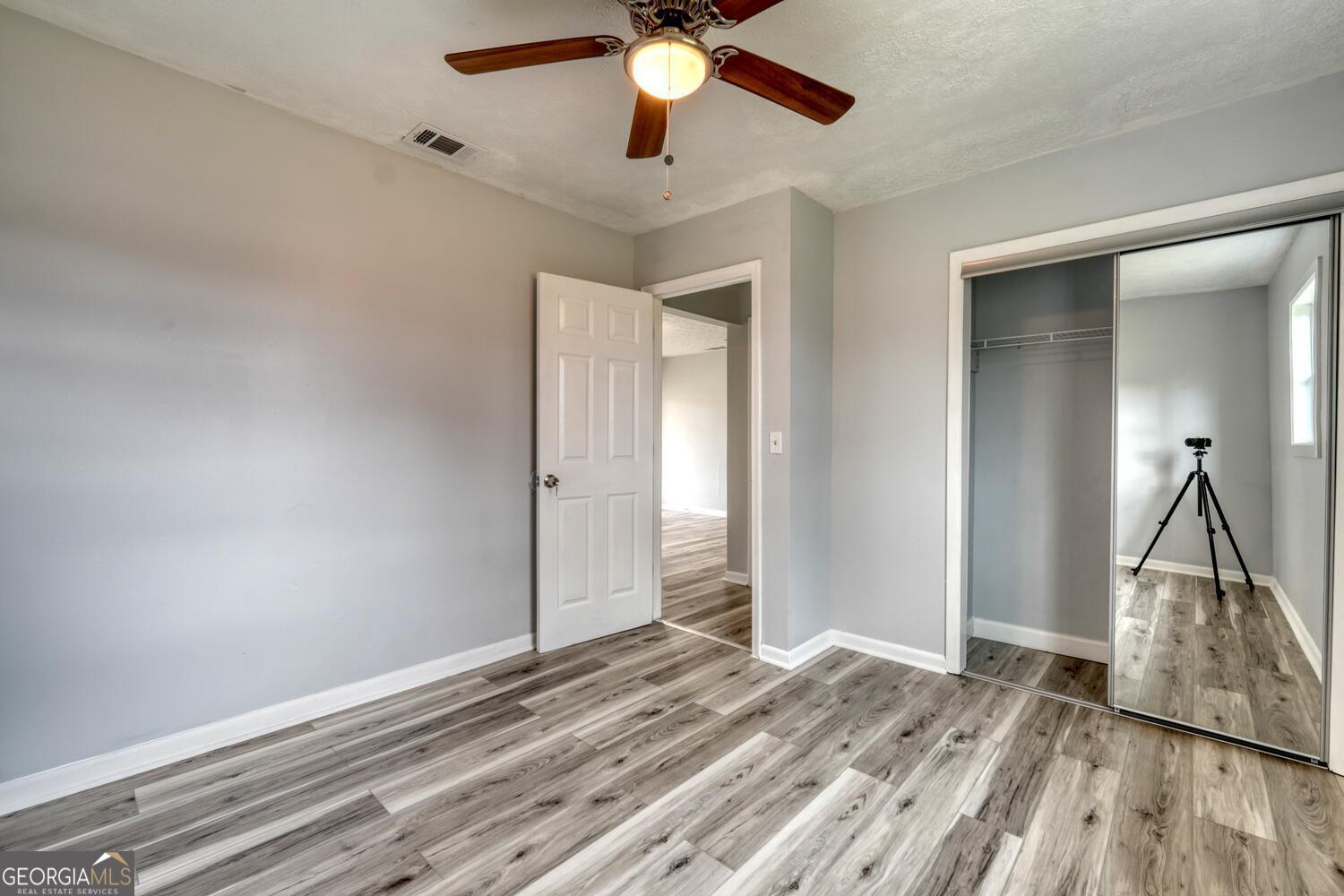 16 Antioch Church Road Blairsville, GA 30512 - Photo 27 of 36 a view of empty room with wooden floor and fan