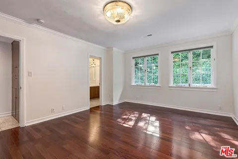 a view of a house with backyard sitting area and garden