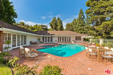 a view of a big yard with a tree