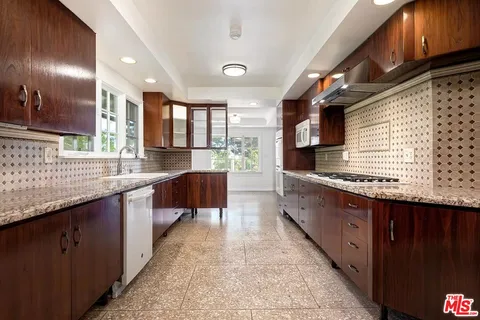 a view of kitchen with furniture and window