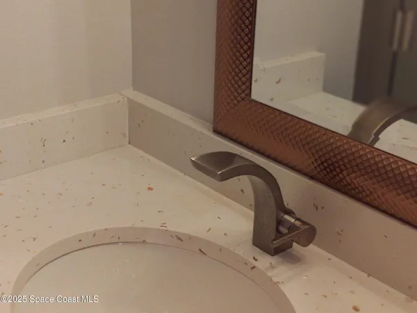 a view of a patio with table and chairs