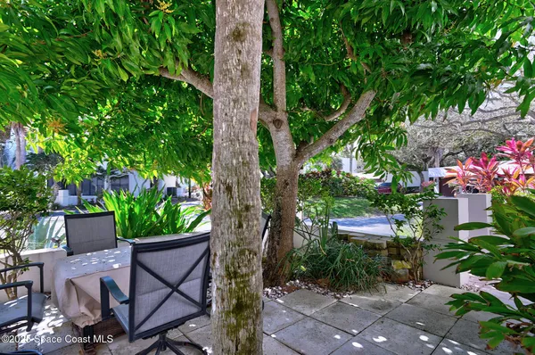 a view of a tables and chairs in patio