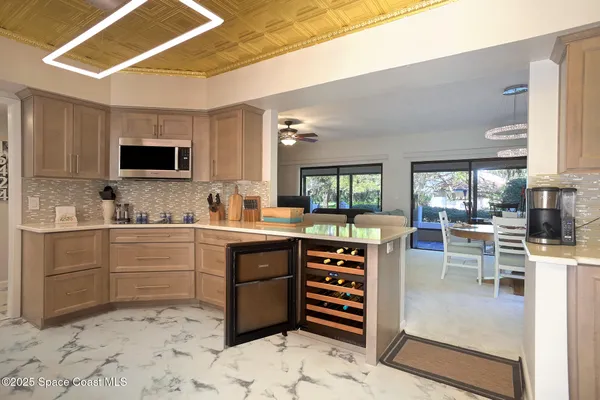 a kitchen with a stove a sink and a refrigerator