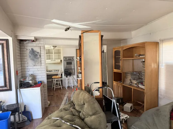 a kitchen with a stove a refrigerator and cabinets