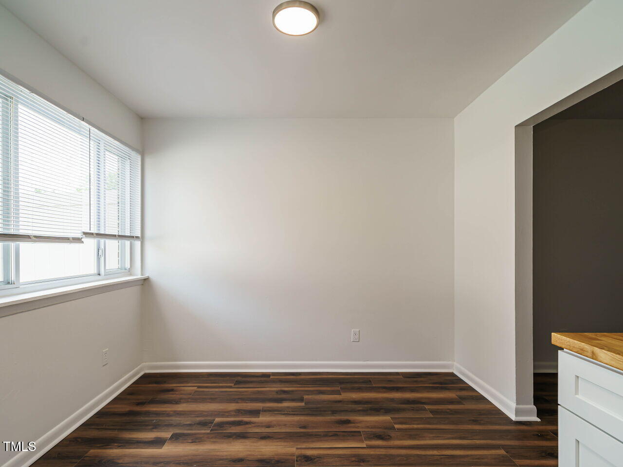 2316 Champion Court Raleigh, NC 27606 - Photo 11 of 27 a view of room with window and hardwood floor