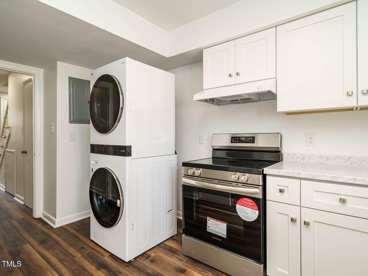 2316 Champion Court Raleigh, NC 27606 - Photo 13 of 27 a kitchen with a stove top oven sink and cabinets
