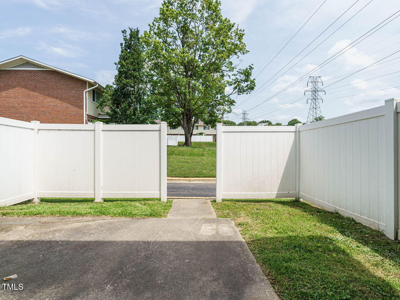 2316 Champion Court Raleigh, NC 27606 - Photo 25 of 27 a view of a house with a yard and garage