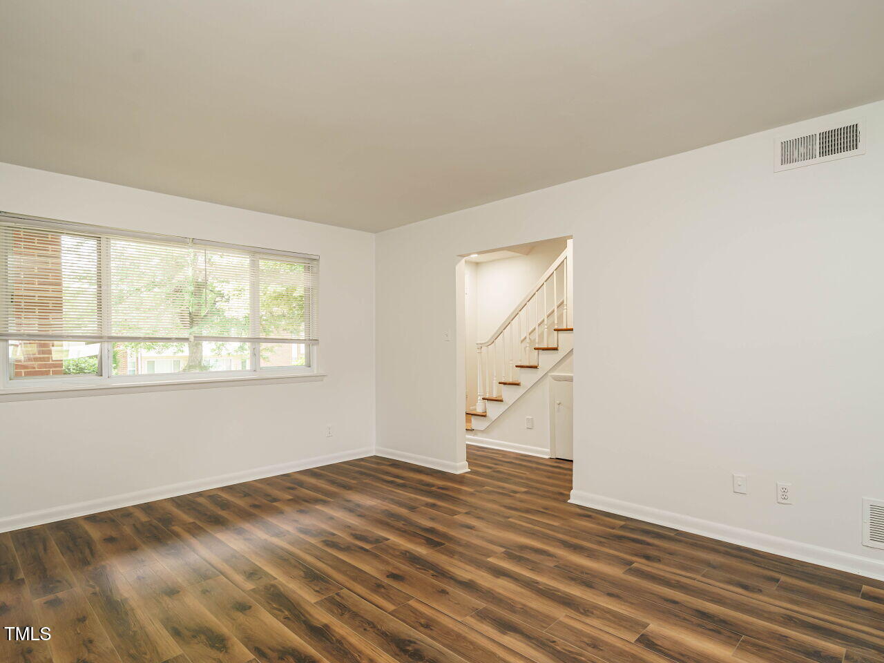 2316 Champion Court Raleigh, NC 27606 - Photo 5 of 27 wooden floor in an empty room