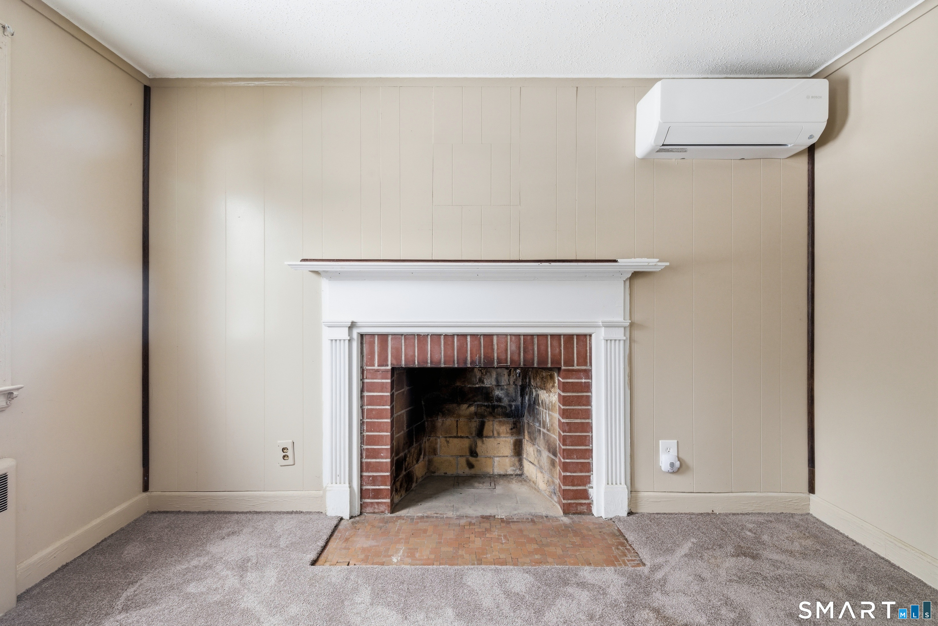 49 Tyler Street Bloomfield, CT 06002 - Photo 11 of 38 a living room with a fireplace