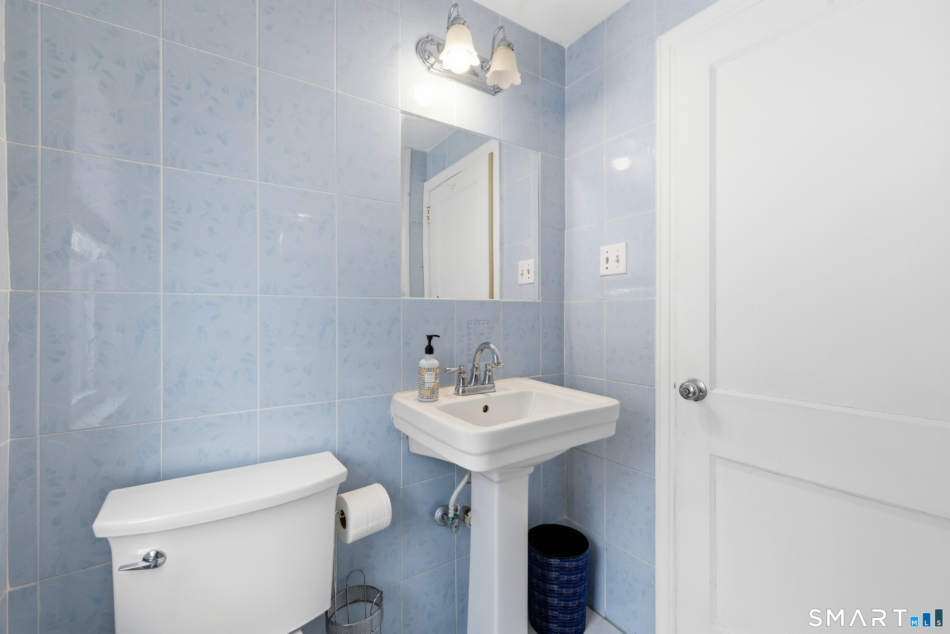 49 Tyler Street Bloomfield, CT 06002 - Photo 15 of 38 a bathroom with a sink toilet and a mirror