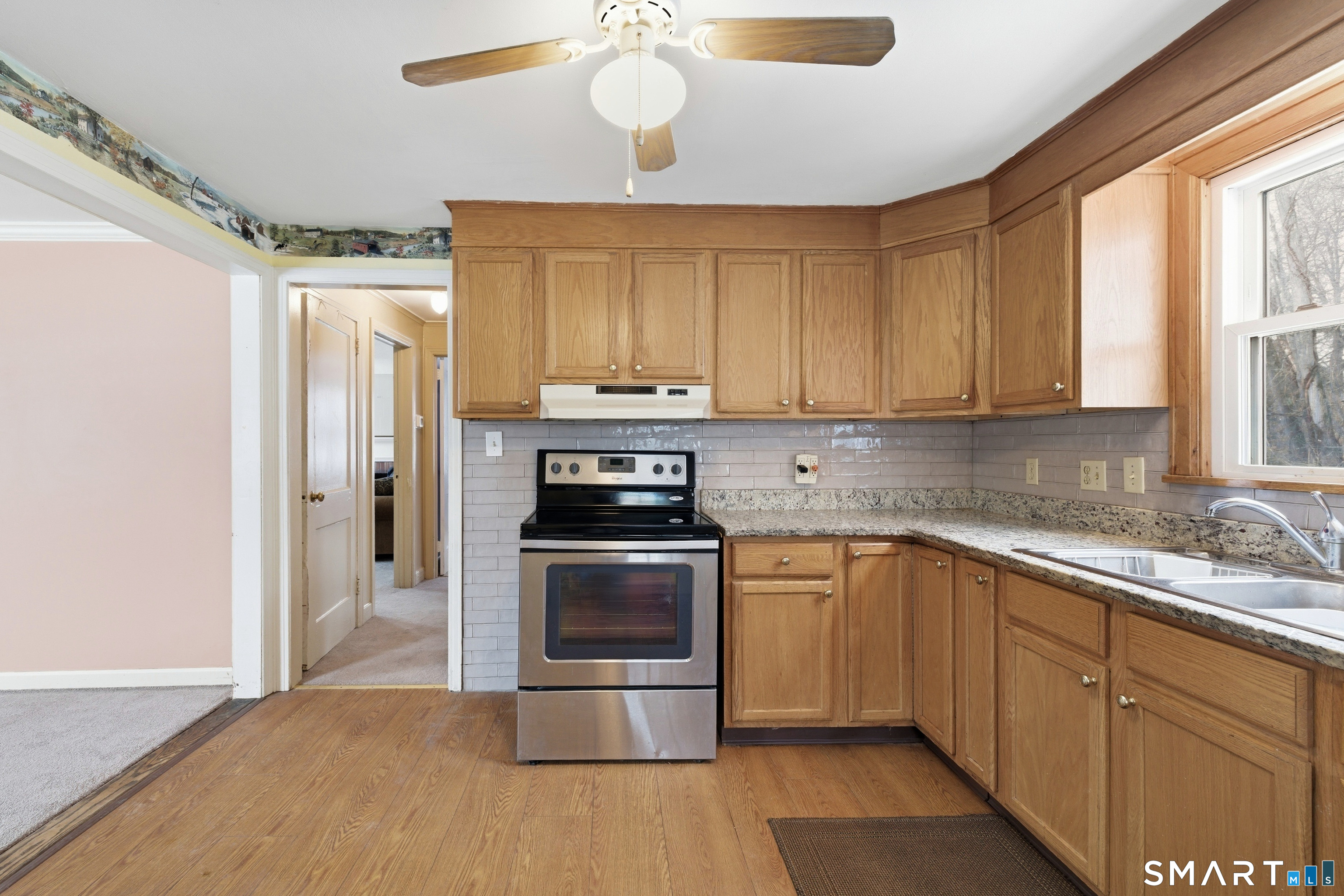 49 Tyler Street Bloomfield, CT 06002 - Photo 22 of 38 a kitchen with stainless steel appliances granite countertop a stove a sink and a refrigerator