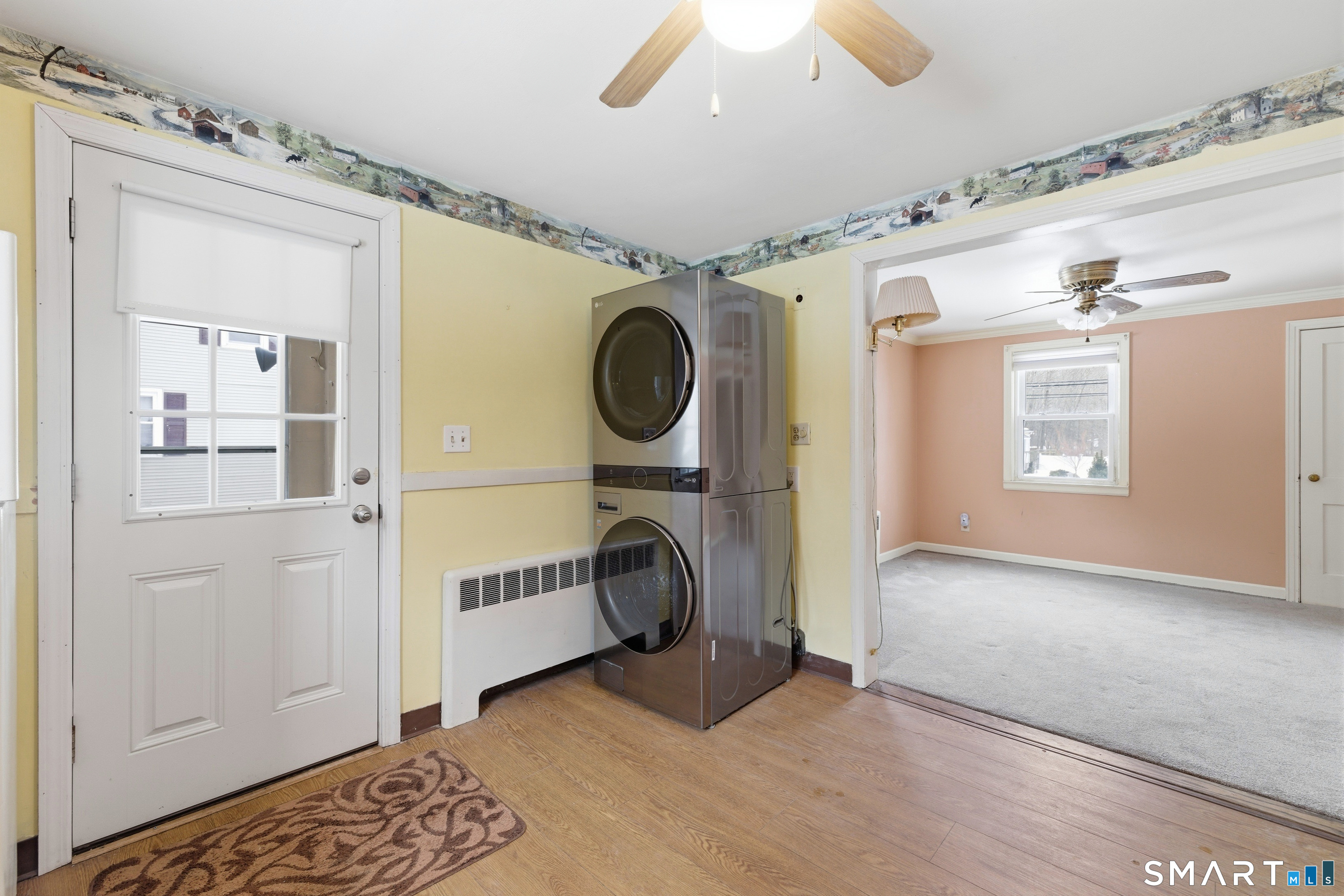 49 Tyler Street Bloomfield, CT 06002 - Photo 23 of 38 a view of a hallway with washer and dryer