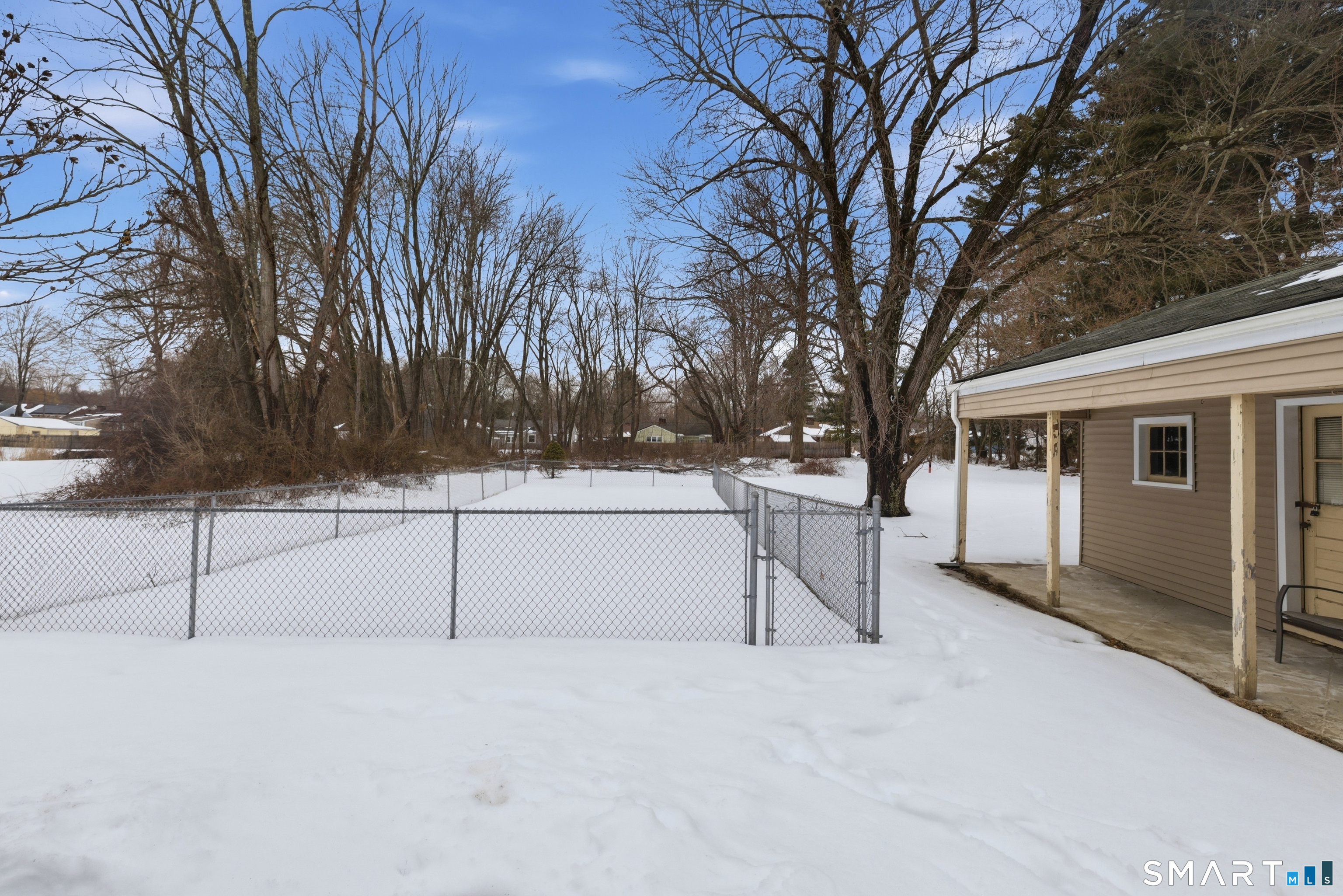 49 Tyler Street Bloomfield, CT 06002 - Photo 34 of 38 a view of house with trees in the background