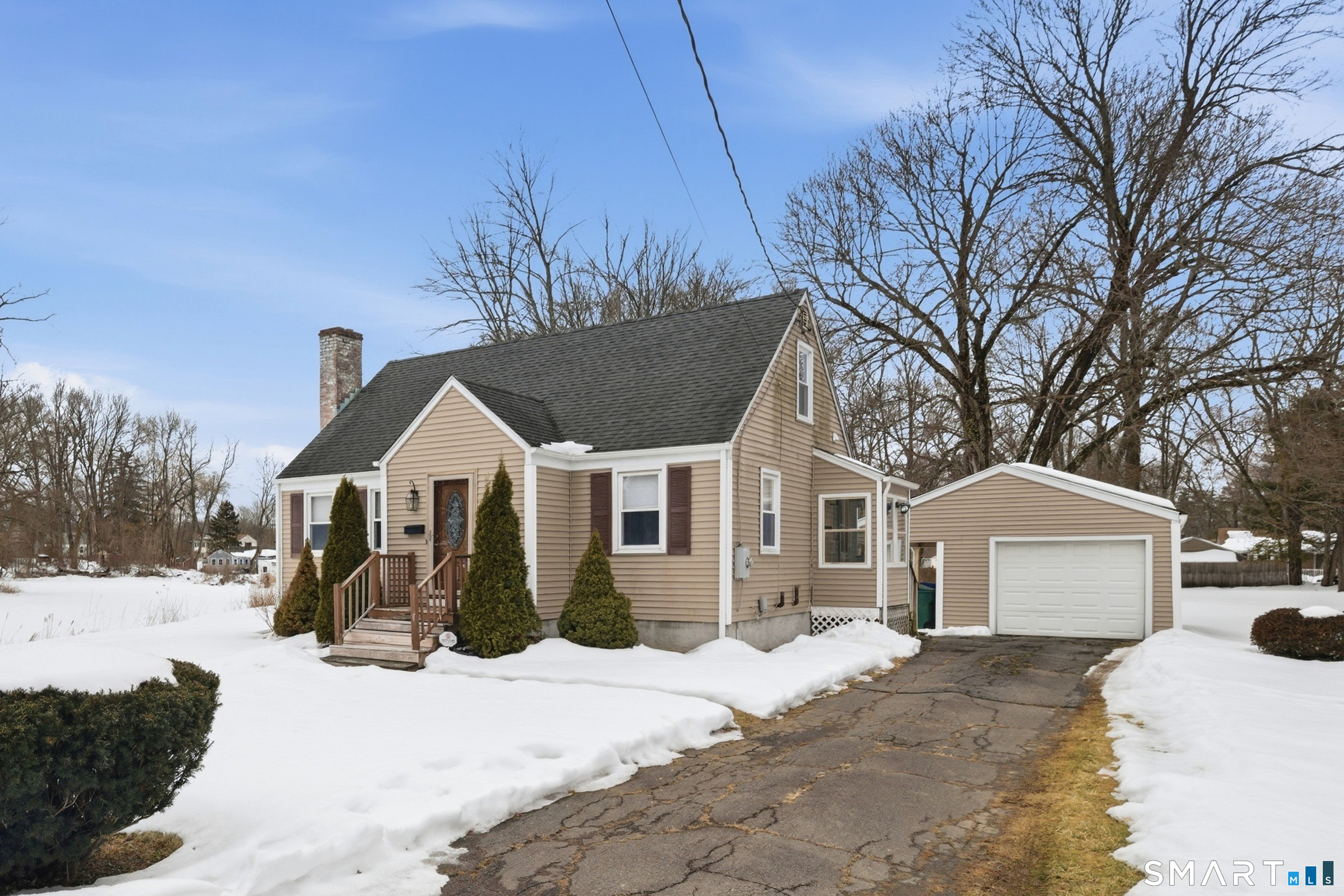 49 Tyler Street Bloomfield, CT 06002 - Photo 4 of 38 a front view of a house with a yard