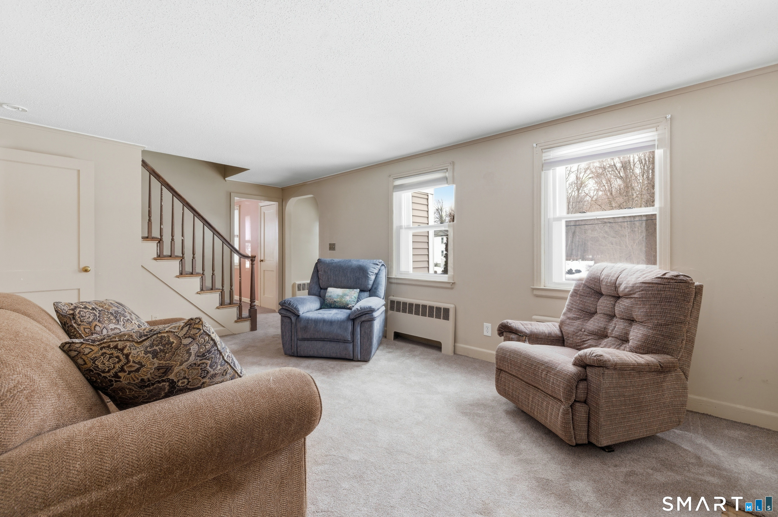 49 Tyler Street Bloomfield, CT 06002 - Photo 10 of 38 a living room with furniture and a window