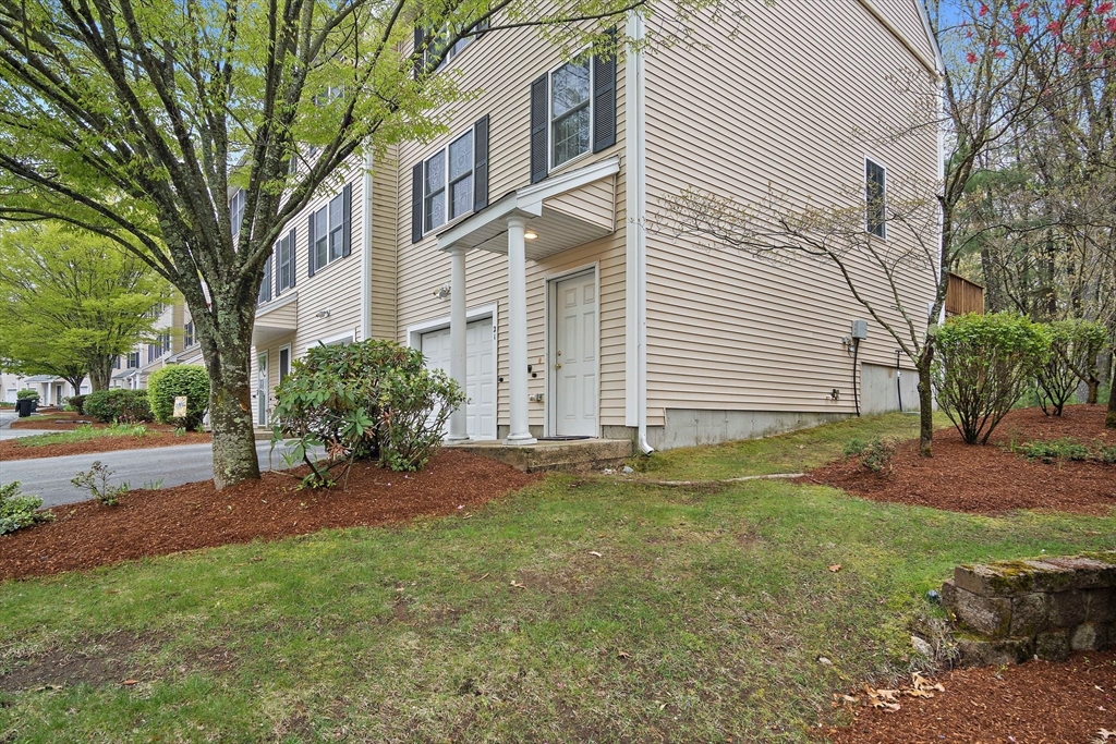 81 Salem Road, Unit 21 Billerica, MA 01821 - Photo 1 of 21 a view of a backyard with a garden