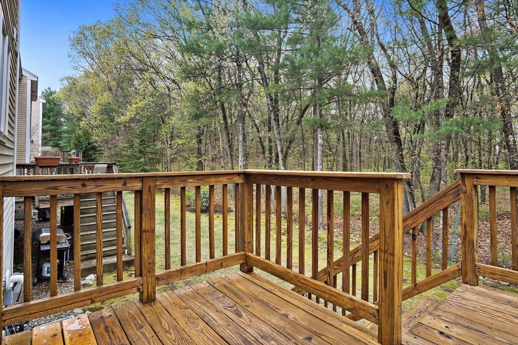 81 Salem Road, Unit 21 Billerica, MA 01821 - Photo 7 of 21 a view of balcony with wooden floor and fence