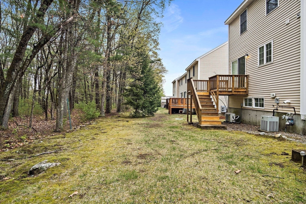 81 Salem Road, Unit 21 Billerica, MA 01821 - Photo 9 of 21 a view of a house with backyard