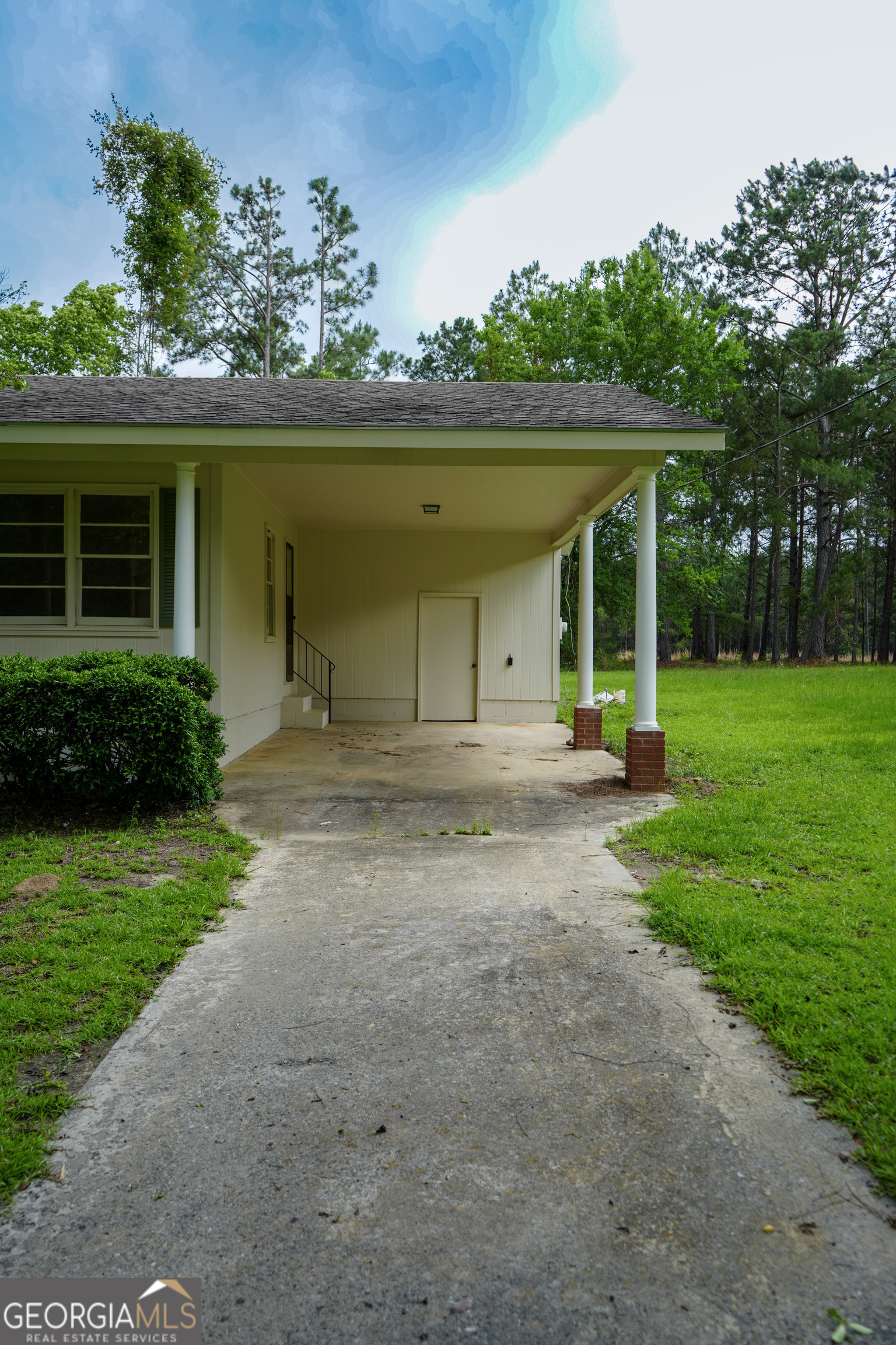 1869 Minter Blue Springs Road Rockledge, GA 30454 - Photo 14 of 45 a front view of a house with garden