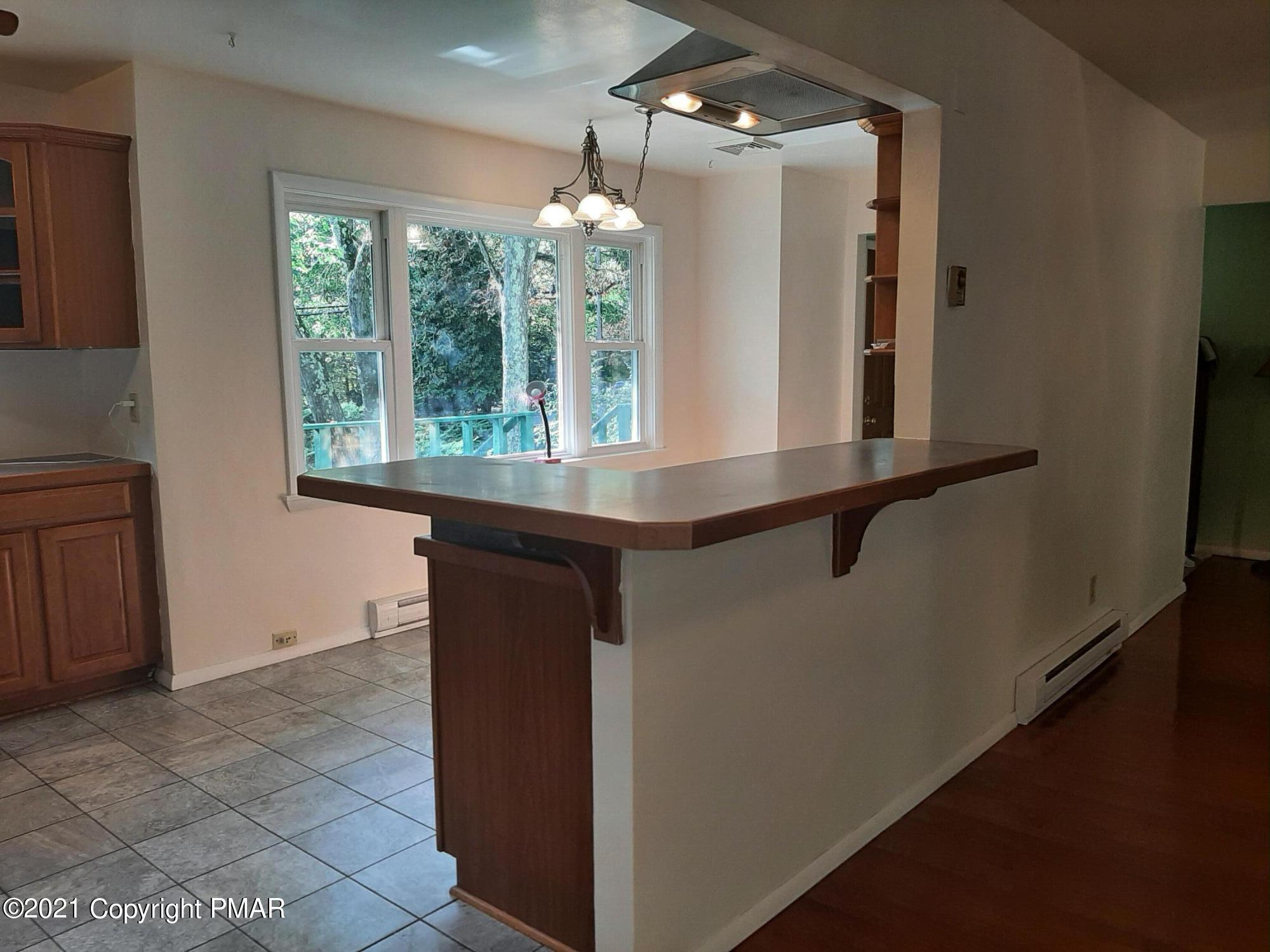 235 Dyson Road Swiftwater, PA 18370 - Photo 13 of 36 a room with a mirror and windows