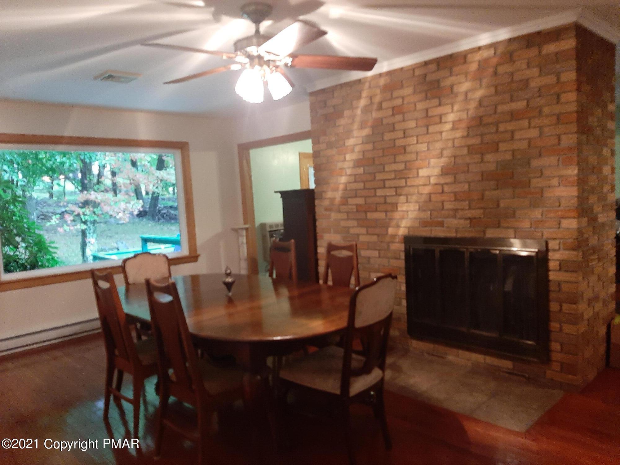 235 Dyson Road Swiftwater, PA 18370 - Photo 15 of 36 a view of a dining room with furniture window and outside view