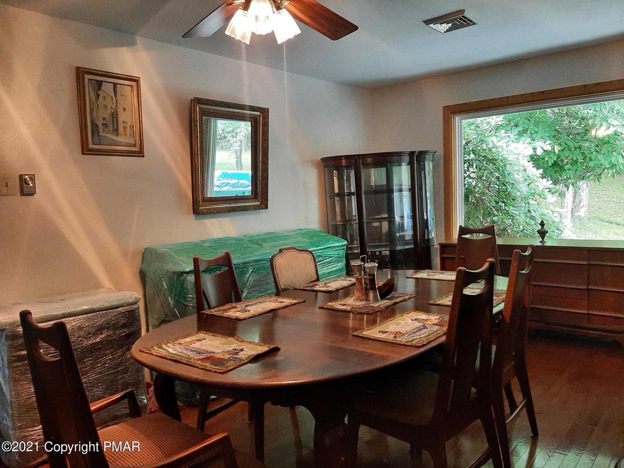 235 Dyson Road Swiftwater, PA 18370 - Photo 16 of 36 a view of a dining room with furniture window and outside view